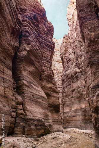 A small shallow stream flows along hiking trail in the Wadi Numeira gorge in Jordan