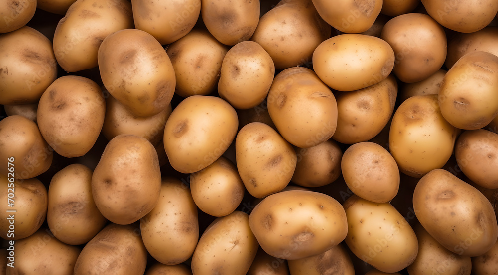 Fresh Potatoes Texture, Top view of a pile of raw, unpeeled potatoes with a natural brown hue Fresh Potatoes Texture, Top view of a pile of raw, unpeeled potatoes with a natural brown hue