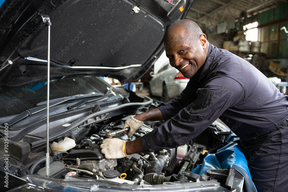 custom made wallpaper toronto digitalAfrican mechanic worker checking and fixing a car in garage