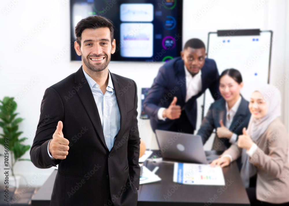 The chief executive stood for a photo after a meeting to plan the company's business. The chief executive stood for a photo after a meeting to plan the company's business.