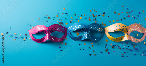 variety of party eye mask with colorful confetti on blue backdrop