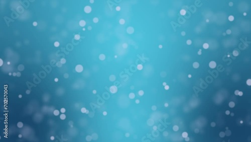 Animated teal blue bokeh background with glowing light particles photo