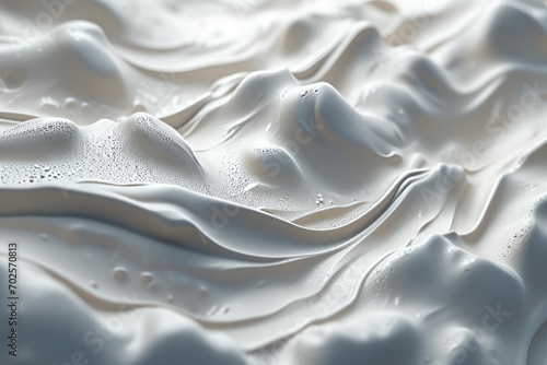 Close up of white creamy texture with smooth peaks and valleys