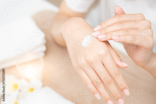 spa and treatment skin hand, Woman applying organic moisturizing hand cream, hand skin care concept, winter, female skin protection, beautiful woman skin care with hand cream, lotion on hands photo
