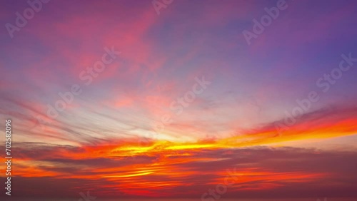 aerial hyperlapse view The bright light illuminated the clouds drifting in the sky. 
Magical clouds formed spirals in colorful sunset.
colorful clouds spinning around in a mesmerizing dance. photo