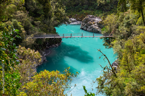 the view of lower birdge in Hokitika Gorge, a major tourist destination some 33 km or 40 minutes drive inland from Hokitika, New Zealand With stunning blue waters and spectacular rock formations. photo