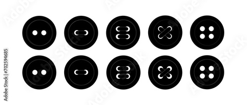 Set of black buttons. Buttons with two and four holes. Buttons are sewn on. Sewing decor, elements.