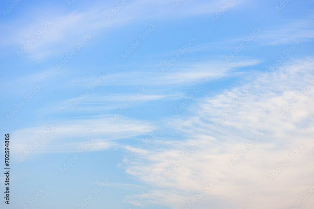 A beautiful sky tinted by the sun leaving vibrant shades of gold, pink, blue and multicolored. Clouds in the twilight evening and morning sky. Cloudy sky background in the evening and during the day.