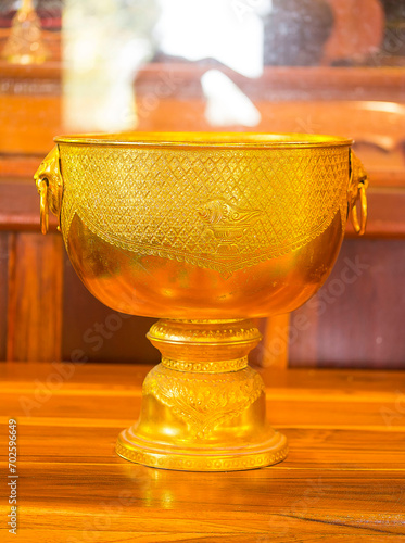 gold tray offered to monks