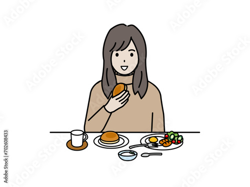 朝食を食べる若い女性のイラスト