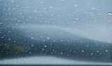  Rain drops on the windshield of the car wetness in the rainy season. protection against rain background with water drops on car windshield high quality windshield. from AI Generative