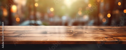 Counter mockup. Empty wooden table or boards with blured glitters in background.