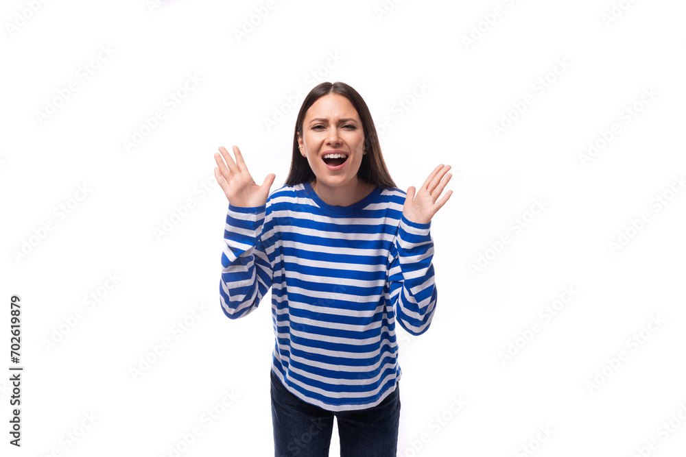 young groovy cheerful caucasian woman with dark hair dressed in a blue striped sweatshirt on a white background young groovy cheerful caucasian woman with dark hair dressed in a blue striped sweatshirt on a white background