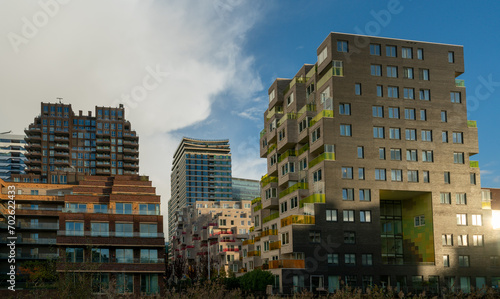 Modern apartment buildings in ZuidAs in Amsterdam, with older office buildings in background in The Netherlands.