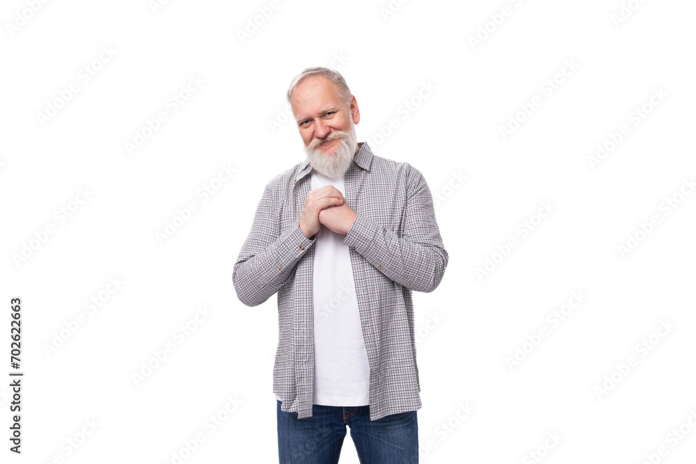 well-groomed gray-haired senior man with a beard and mustache in a shirt is confident well-groomed gray-haired senior man with a beard and mustache in a shirt is confident