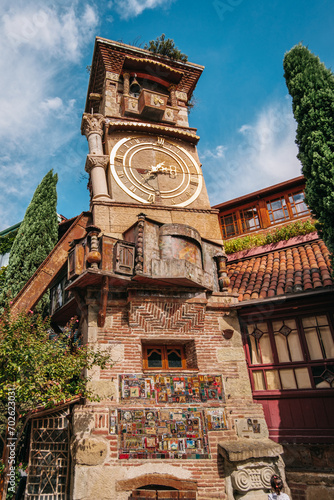 Rezo Gabriadze's leaning clock tower in Tbilisi Old Town, Georgia photo