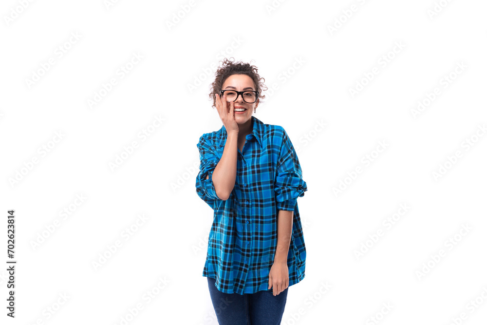 portrait of a young pretty woman with curled hair smiling on a white background
