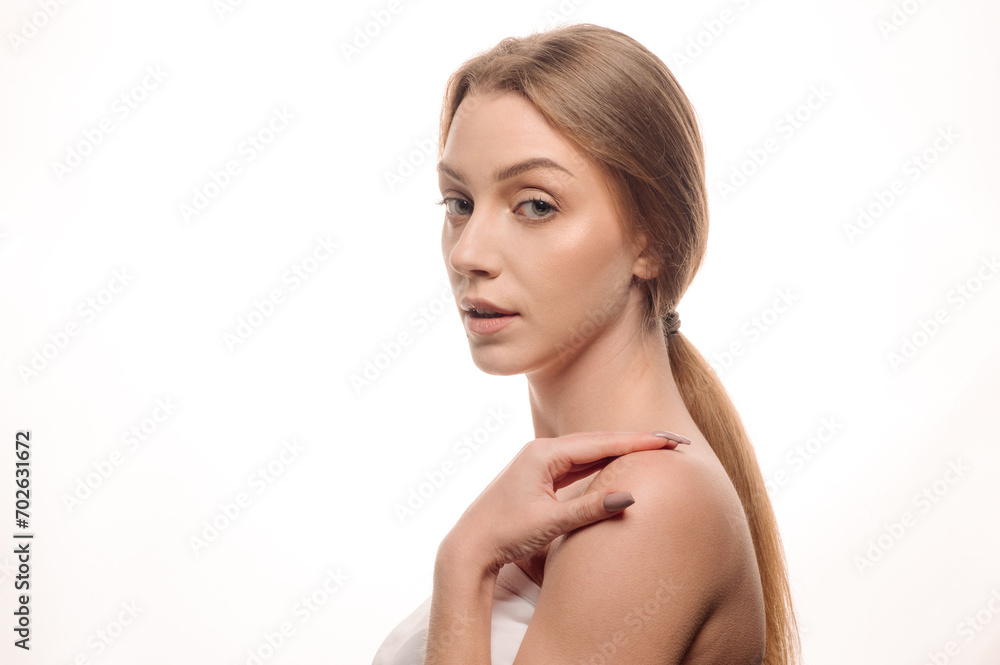 Beauty portrait of a blonde girl posing on an isolated white background. Skin care concept Beauty portrait of a blonde girl posing on an isolated white background. Skin care concept