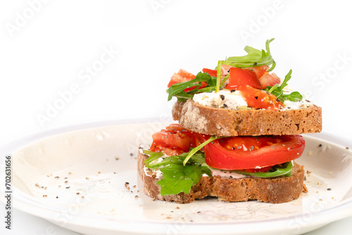 Sandwiches with soft cheese and herbs and tomatoes