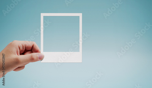 Female hand holding an instant picture
