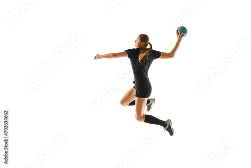 Valokuva Fit young woman engaged in intense handball training, perfecting her throwing and catching abilities against white studio background