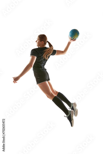 Athletic young woman, sportsman showing handball techniques, emphasizing skill and dedication against white studio background. Concept of professional sport, movement, dynamic, workout, championship.
