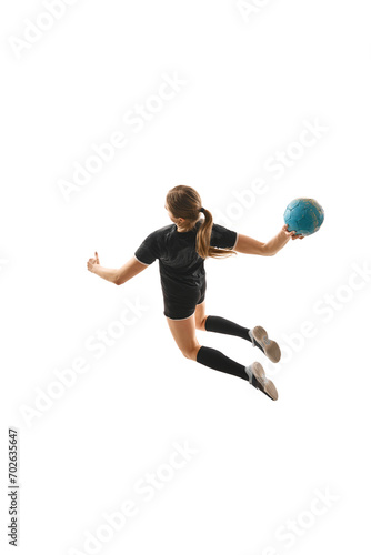 Top view portrait of skilled female handball player in motion, executing powerful throw with determination against white background. Concept of professional sport, movement, dynamic, championship.