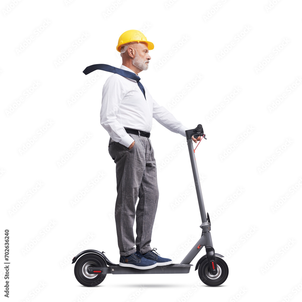Architect wearing a safety helmet and riding a scooter Architect wearing a safety helmet and riding a scooter