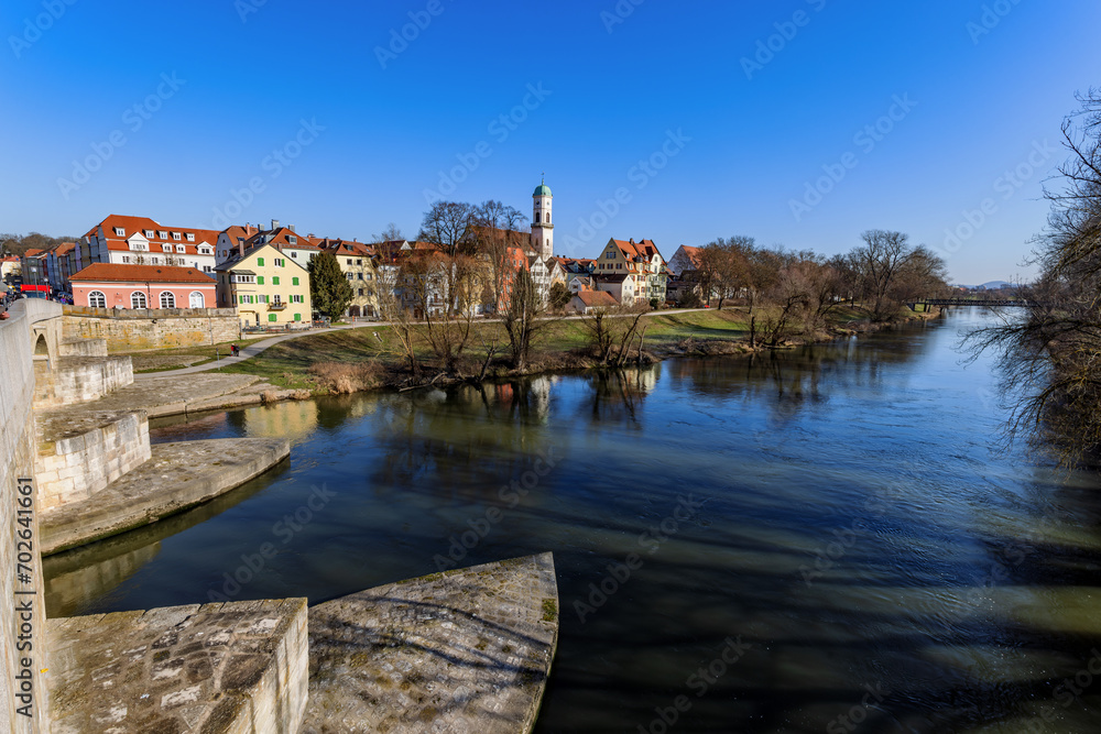 View over the Danube river from the stone bridge in Regensburg, Bavaria, Germany.