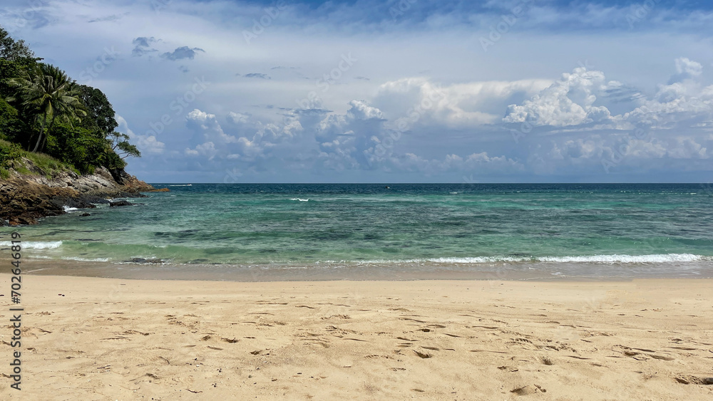 Exotic beaches with sand, blue sea, blue skies, and rocky cliffs with green plants. Exotic beaches with sand, blue sea, blue skies, and rocky cliffs with green plants.