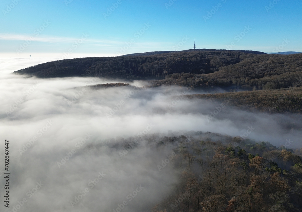 View over clouds of the radio tower Kamzik in Bratislava, Slovakia