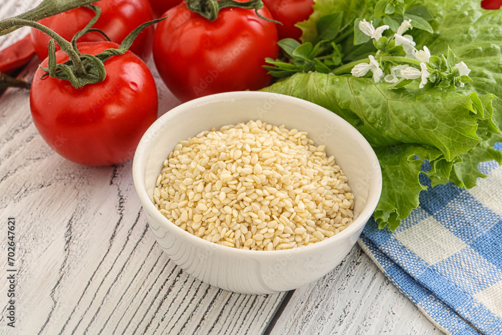 Raw sesame seeds in the bowl Raw sesame seeds in the bowl
