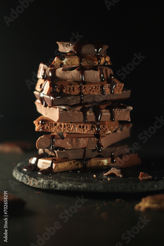 A stack of different chocolate pieces