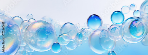 Transparent soap bubbles floating on abstract background. Cleanliness, soap foam photo