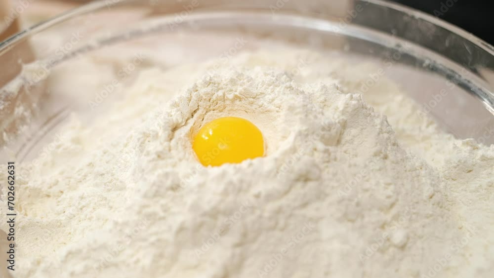 A cook in the kitchen sifts flour through a sieve. Kneading raw dough with male hands. Breaks an egg. White flour. A cook in the kitchen sifts flour through a sieve. Kneading raw dough with male hands. Breaks an egg. White flour.