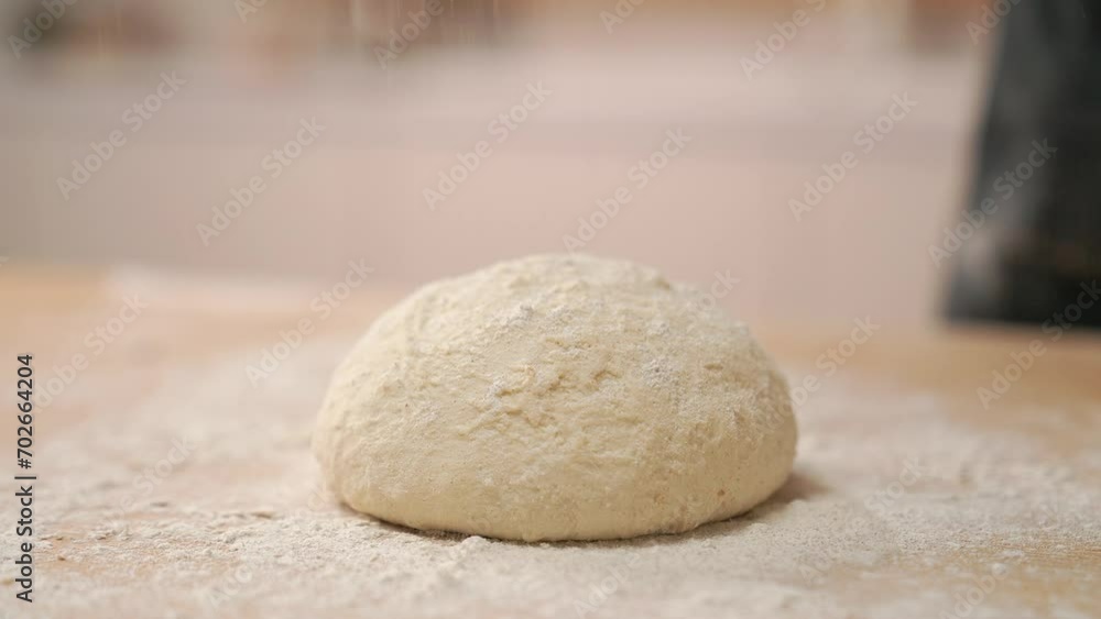 A cook in the kitchen sifts flour through a sieve. Kneading raw dough with male hands. Breaks an egg. White flour. A cook in the kitchen sifts flour through a sieve. Kneading raw dough with male hands. Breaks an egg. White flour.