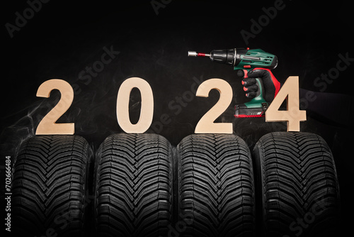 Car tires, winter wheels, isolated new tyres, mechanic man 2024 banner background