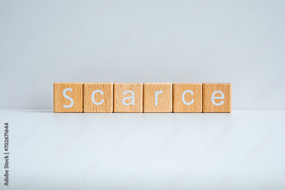 Ταπετσαρία Wooden blocks form the text Scarce against a white background.