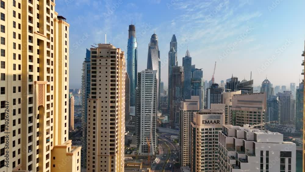 Aerial view of Dubai Marina. Dubai Marina is an affluent residential neighborhood known for The Beach. Aerial view of Dubai Marina. Dubai Marina is an affluent residential neighborhood known for The Beach.