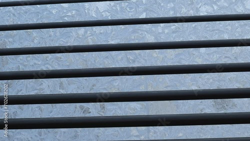 Heavy frost outside, which caused the windows to freeze. Raising the blinds and seeing the frosty pattern on the windows