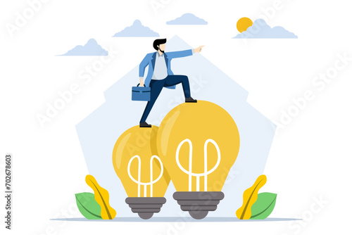 Creative Thinking Concept, Smart businessman standing on idea light bulb and looking forward. using imagination and creativity to find solutions or solve business problems, contemplation or ideas.