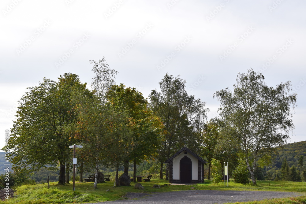 chapel between autumn trees chapel between autumn trees
