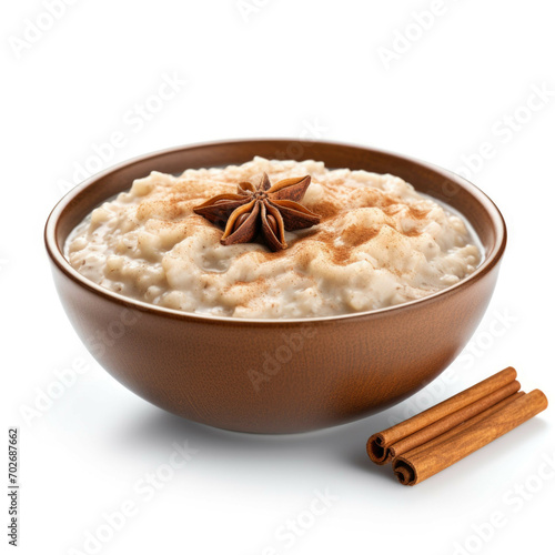 A bowl of freshly cooked oatmeal with a sprinkle of cinnamon, isolated on white background