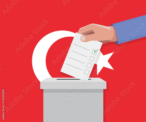 Turkey election concept. Hand puts vote bulletin