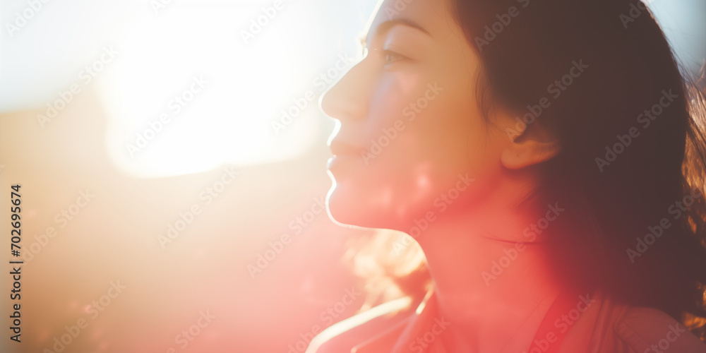 Woman in profile with sunlight caressing her face, a glow of warmth and hope Woman in profile with sunlight caressing her face, a glow of warmth and hope