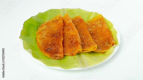 Sweet Boli, Stuffed with a delectable mixture of palm jaggery, coconut, and aromatic cardamom, each bite of Sweet Boli unfolds a symphony of flavors.