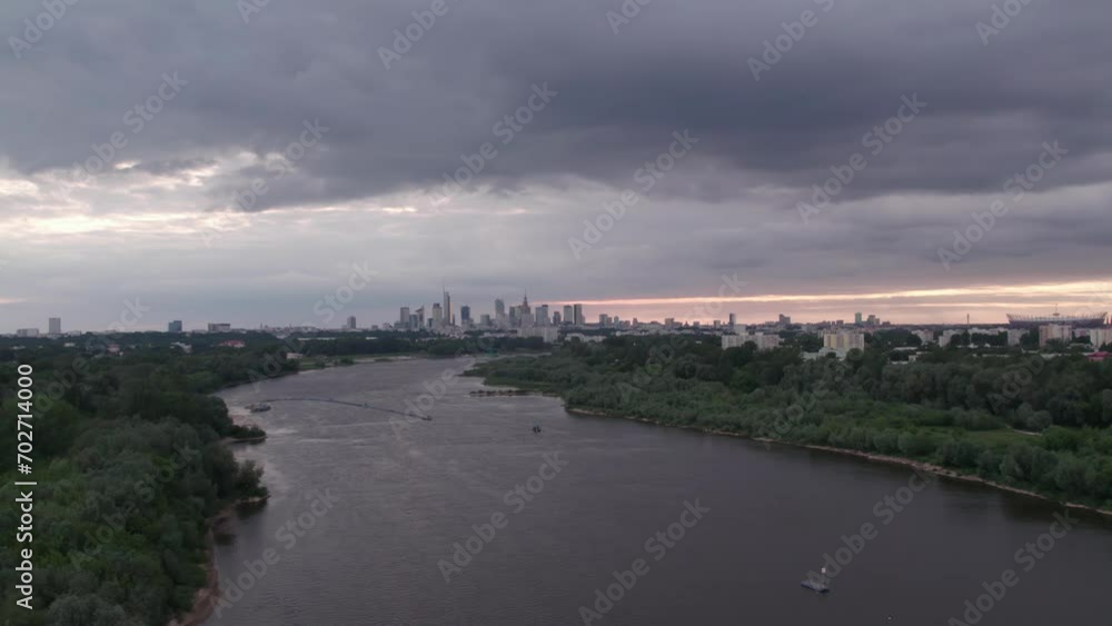 From a drone's perspective, the Vistula River in Warsaw unveils its scenic beauty, winding through the cityscape. From a drone's perspective, the Vistula River in Warsaw unveils its scenic beauty, winding through the cityscape.