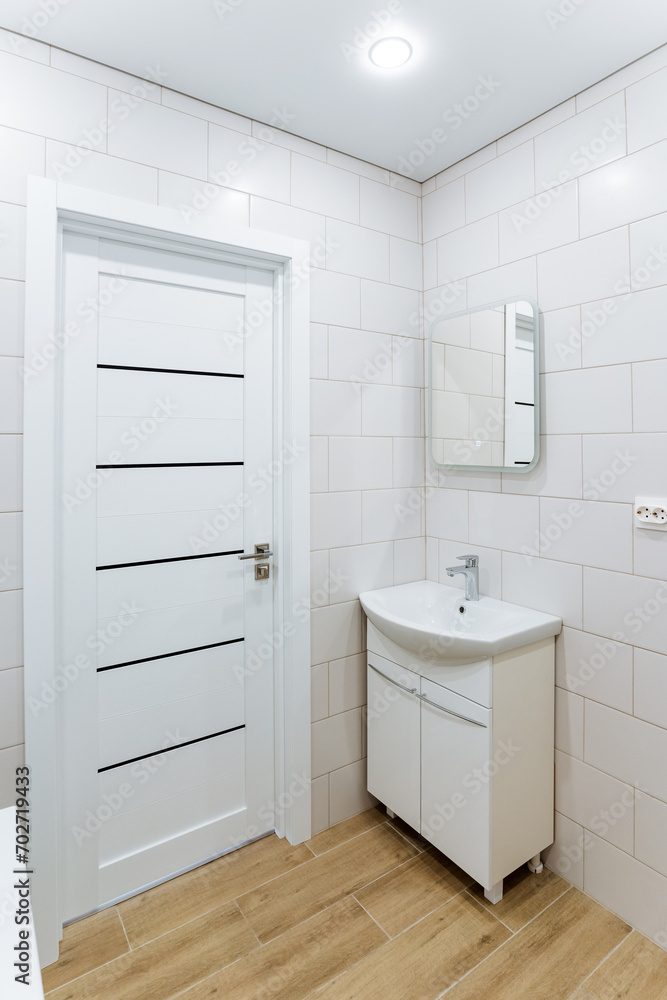 There is a bathroom, a bedside table with a sink in the corner of the room, a make-up mirror, a washbasin in the toilet. There is a bathroom, a bedside table with a sink in the corner of the room, a make-up mirror, a washbasin in the toilet.