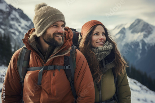 Couple hiking in a snowy mountain landscape