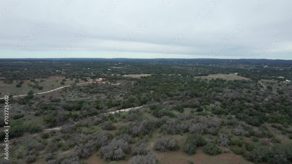 Aerial Shot over a central Texas landscape, hill country, dolly forward Aerial Shot over a central Texas landscape, hill country, dolly forward